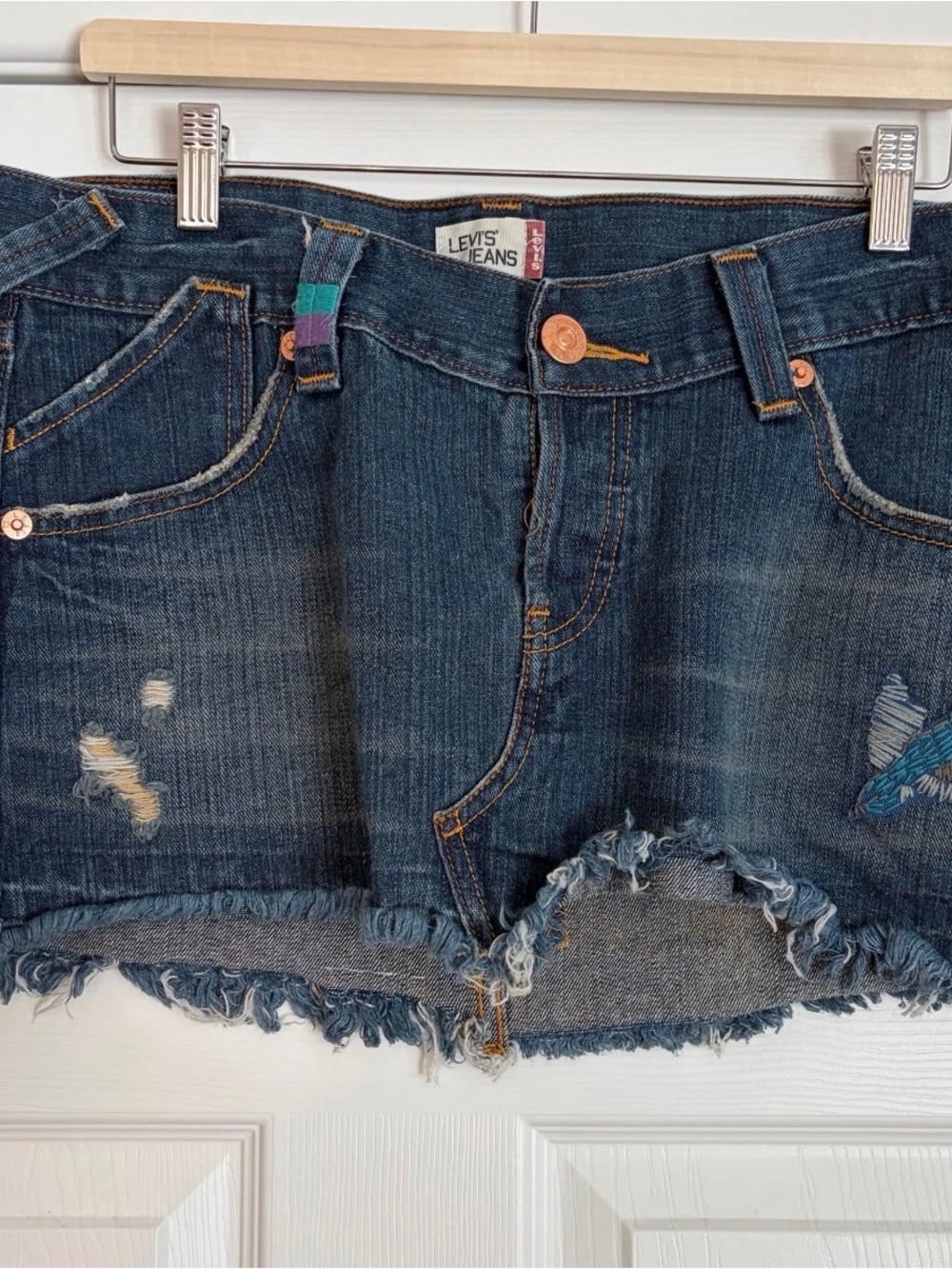 Levi’s embroidered miniskirt with special tag,intentional distressing sz 11